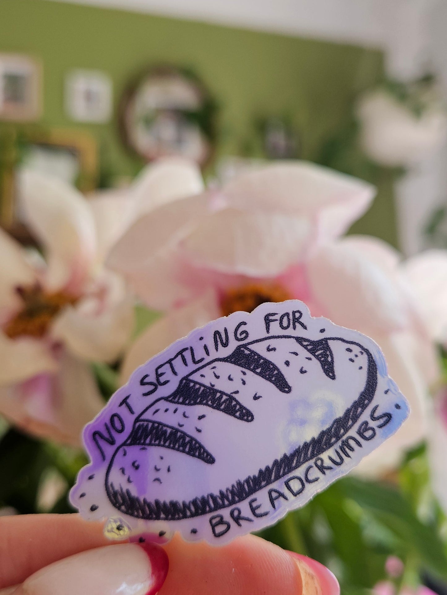 "not settling for breadcrumbs" holographic sticker